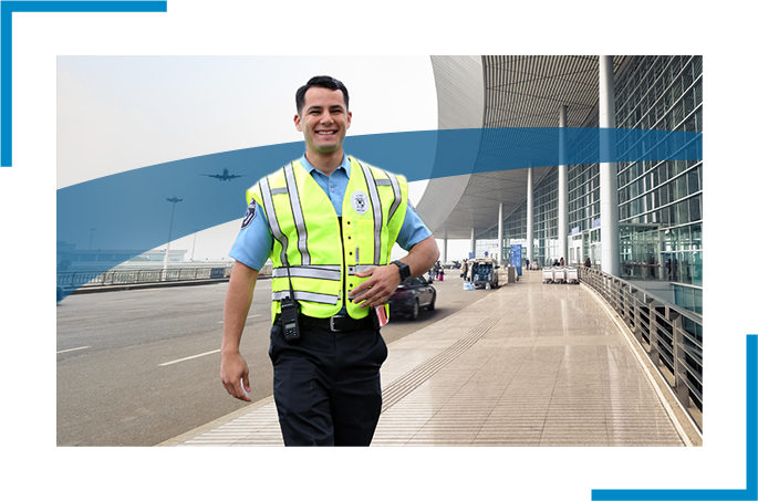 A uniformed security guard salking in a bus station