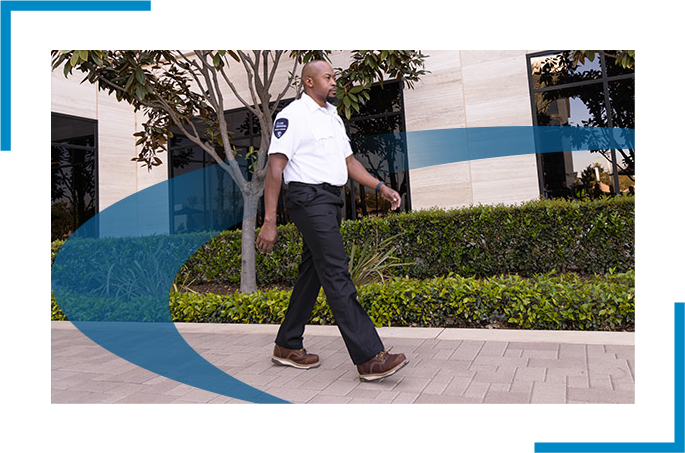 Security guard in white uniform is walking